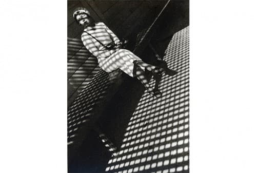 Alexander Rodechenko, GirlwithLeica · gelatin silver print mounted on handmade archival paper · 43.18cmx35.56 cm · printed 1994 · Alexander Rodechenko, GirlwithLeica · gelatin silver print mounted on handmade archival paper