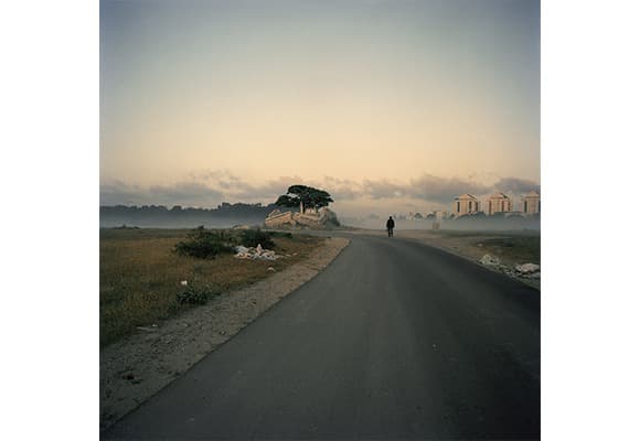 Demetris Koilalous (Athens, Greece), ‘Hadera; migrant worker walking towards the town’ · Archival Inkjet print · 6×6 cm Medium Format Color Negative Film · 2012, from the series ‘Heterotopia’ (2012-2017), FOTOFILMIC18 Buschlen Mowatt Nichol Foundation Prize