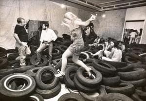 Allan Kaprow (center, with beard) and participants in his “Yard”